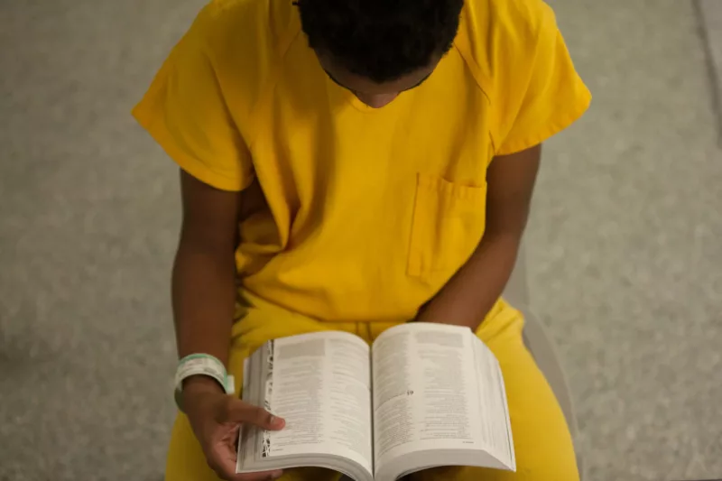 JJM young person reading Bible