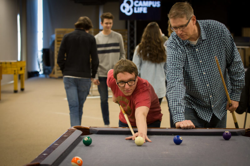 YFC Leader and student playing pool
